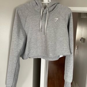 Gymshark, medium gray cropped hoody.